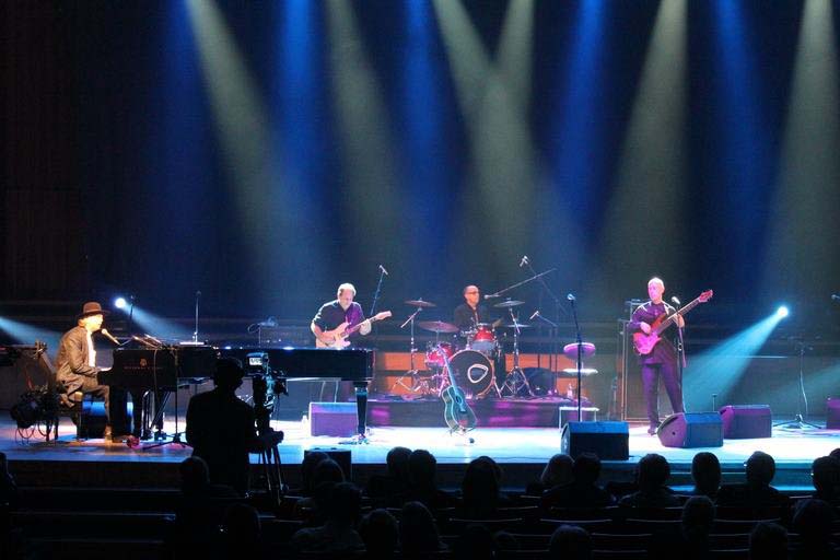 Al Orlo performing on stage with Nenad Bach Band